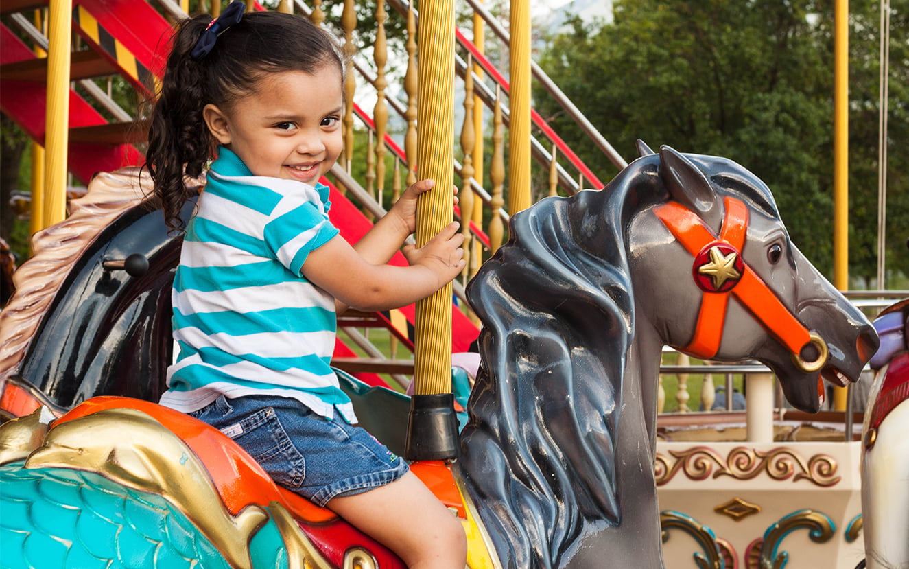 Theme Park-little girl on fake horse